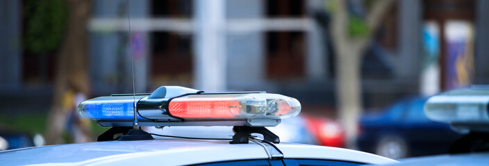 Police car against city street