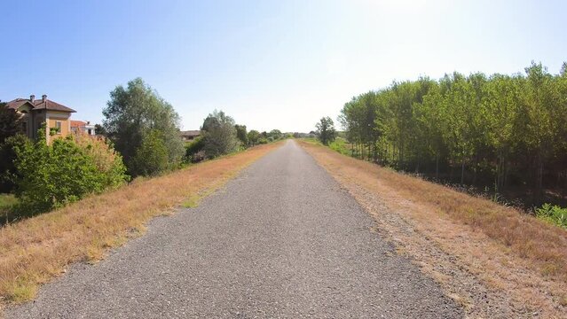 Via Francigena - a country road on the embankment along the Po river next to San Zenone al Po, province of Pavia, Lombardy, Italy