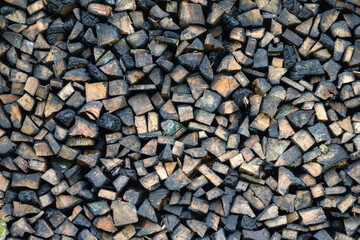 
Chopped logs of firewood piled on top of each other