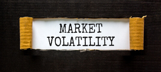 Market volatility symbol. Concept words Market volatility on beautiful white paper. Beautiful black paper background. Business market volatility concept. Copy space.orange