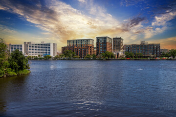 A beautiful summer landscape along Cape Fear River with hotels and office buildings in the city...