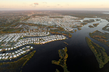 Heavy flood with high water surrounding residential houses after hurricane rainfall in Florida...