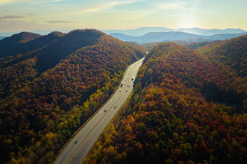 I-40 freeway road leading to Asheville in North Carolina thru Appalachian mountains with yellow...