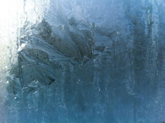 Frost on the window pane. Frosty pattern.