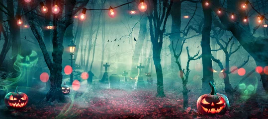 Fototapeten Halloween - Hunted Forest With Pumpkins And Ghosts At Moonlight - Jack O’ Lanterns In Cemetery With String Light At Twilight © Romolo Tavani