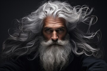 A picture of a man with long white hair and a beard. This image can be used to depict an elderly person, a wizard, or a wise sage. It can also be used in fantasy or historical-themed designs.