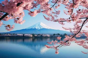 Papier Peint photo Mont Fuji A beautiful view of a mountain with cherry blossoms in the foreground. This picture can be used to depict the serene beauty of nature and the arrival of spring.