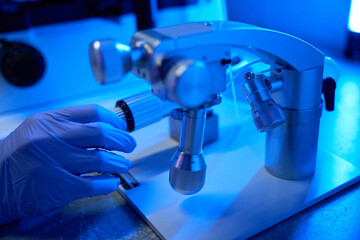Person works with a special apparatus in a scientific laboratory
