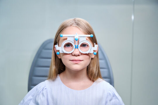 Calm young patient taking eye refraction test