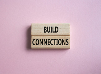 Build Connections symbol. Concept word Build Connections on wooden blocks. Beautiful pink background. Business and Build Connections concept. Copy space
