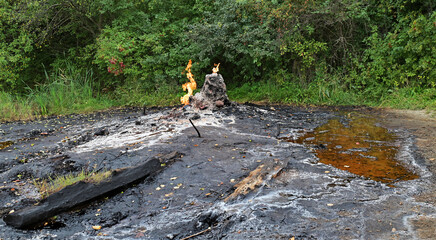 Combustion of gas on place of the old ozokerite mine. Ecological catastrophe.