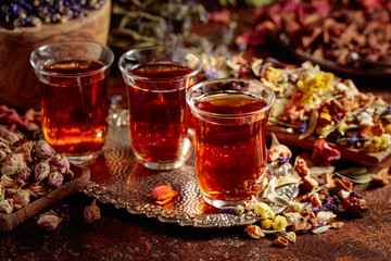 Herbal tea and a mix of various dried medicinal plants and herbs.