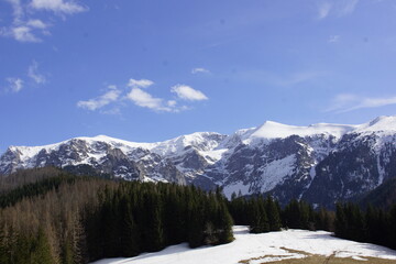 Fototapeta na wymiar snow covered mountains in spring