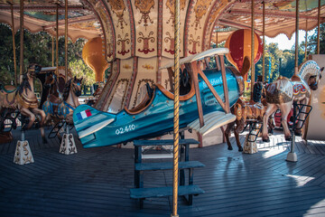 Amusement park plane on a carousel concept photo. Front view photography