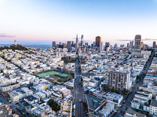 Aerial view of urban borough and downtown with high rise office skyscrapers in background. San...