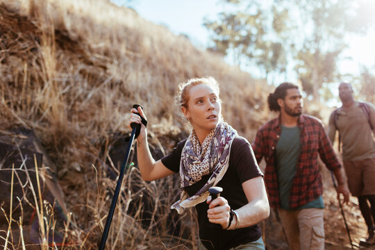Young and diverse group of people hiking together in Africa
