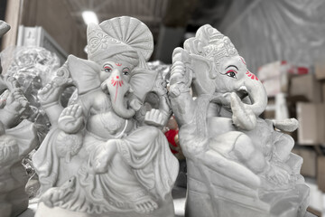 Clay statues lord Ganesha up for sale in the store for Ganesh festival.