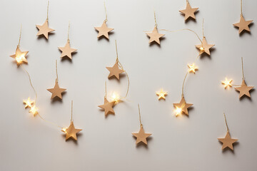 Warm star-shaped light garlands, festive decorations with copy space. Christmas concept. Flat lay, top view