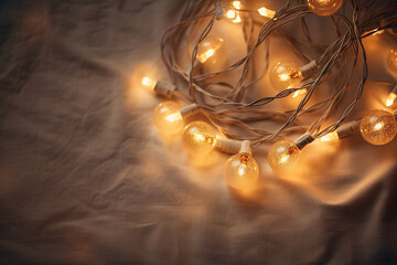 Warm star-shaped light garlands, festive decorations with copy space. Christmas concept. Flat lay, top view