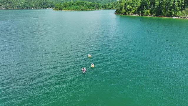 Drone flight passing over kayakers on beautiful Watauga Lake in eastern, Tn.