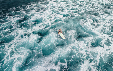 Surfer girl on a wave in Hawaii longboard surfboard