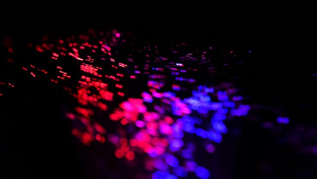 4K Abstract colorful digital particle wave and light abstract background ,animation cyber or technology background.  Festive Fireworks. Isolated on black background. Glowing Particles.