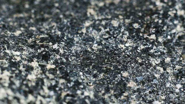 Macro close up of a hard rough granite rock texture 