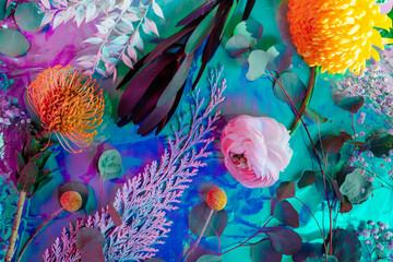 Fototapeta na wymiar Vivid colorful overhead view of floral pattern on gradient background