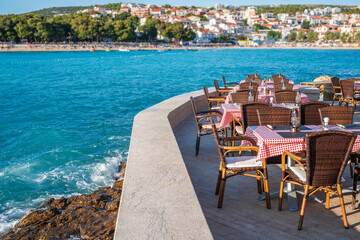 Fototapeta na wymiar The interior of an open-air restaurant on the seashore. Adriatic Sea.