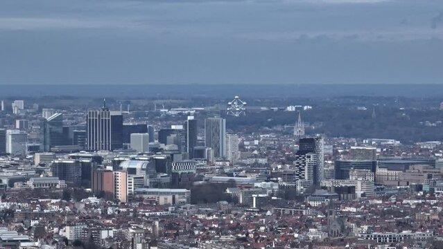Clouds hover as Brussels' aerial expanse marries historic streets with modern vibrancy.
