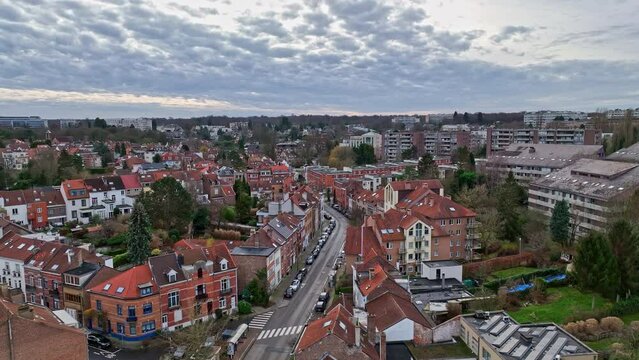 Cloudy day aerial: Brussels' residential beauty meets its bustling economic pulse.
