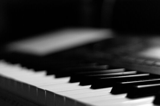 Close-up Shot of Black Piano Keys, Dark Background. Abstract Image