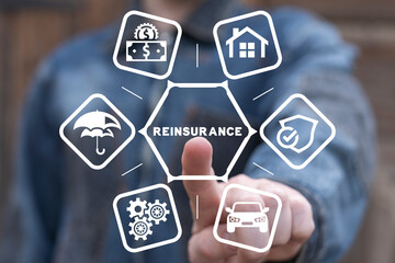 Insurer using virtual touch interface presses abbreviation: REINSURANCE. Concept of reinsurance....