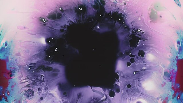 Oil splatter. Colorful stains. Red blue purple black fluid splash spreading paint explosion abstract creative background.