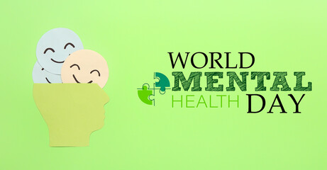 Banner for World Mental Health Day with paper human head and smiling faces