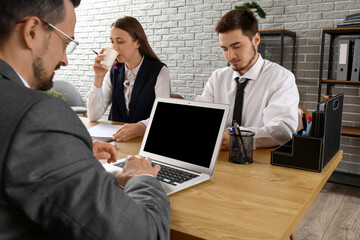 Human resources commission interviewing applicant in office