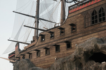 "Kuala Lumpur, Malaysia- September 16, 2023: Selective focus picture part pirate ship at theme park during sunrise."