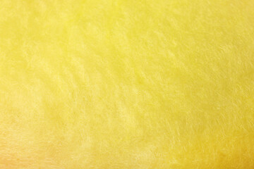 Sweet yellow cotton candy as background, closeup