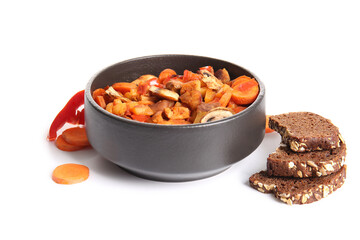 Bowl of tasty beef stew, bread and carrot on white background