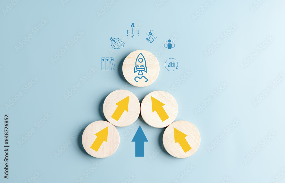 Aufkleber business growth success arrow up with rocket launch concept, arranging wooden block stacking as step