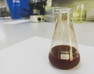 Hematoxylin reagent after filtering for histology slide staining. Medical laboratory testing concept.