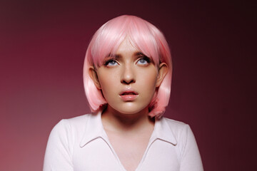 Portrait of a Young Woman with a Pink Bob: A Chic Expression of Modern Femininity. Ideal for...