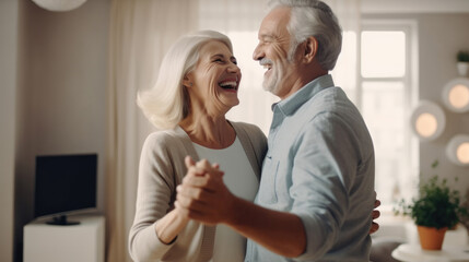 Fototapeta premium Keep moving. Romantic senior family couple wife and husband dancing to music together in living room, smiling laughing retired man and woman having fun, enjoying free time together at home