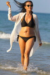 Woman body pretty with black  bikini on beach