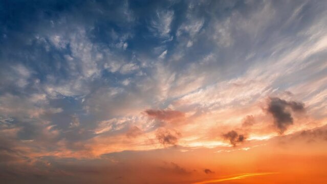 Colorful sky sunset clouds nature landscape. Orange clouds change shapes in the sky. Sky cloud time lapse video.