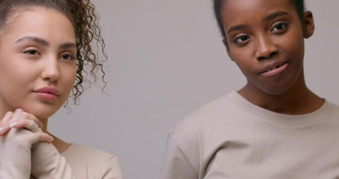 different beauty, women with different nationalities posing to camera Camera motion Slow motion, diverse female models agains beige background