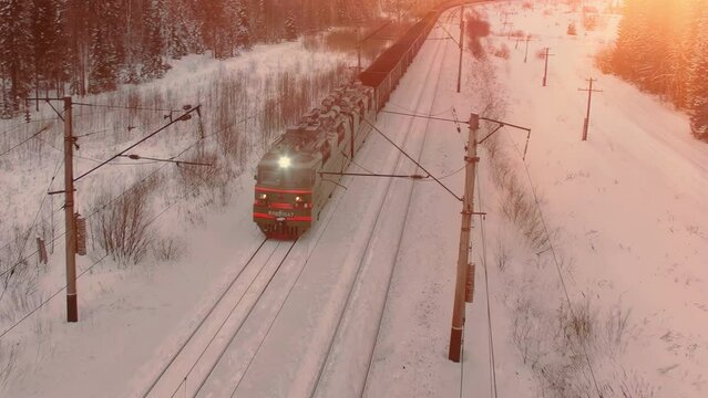 Aerial view of cargo train at winter time. Delivery concept.