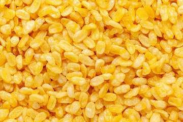Close-up of crunchy Moong Dal (Namkeen) full-frame wallpaper. Indian spicy snack made with roasted Mung beans. Top View.