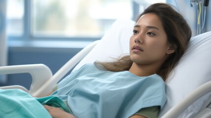 Young woman patient lying on the bed in hospital.