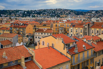 Obraz premium Aerial view of the bourgeois buildings and terracotta rooftops of the Carre d'Or Golden Square chic seafront district in Nice, South of France